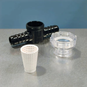 Four plastic plumbing components on a gray surface with a blue background